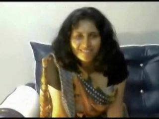 Desi indian young woman stripping in saree on webcam showing bigtits